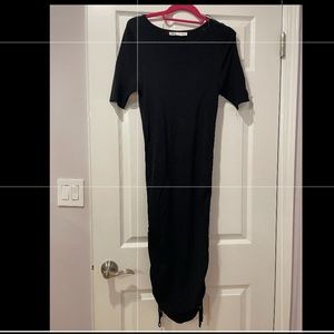 Zara straight black dress with ruched details on the side. Very good condition!